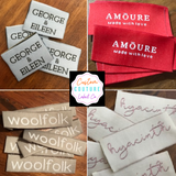 Woven labels with self adhesive backing